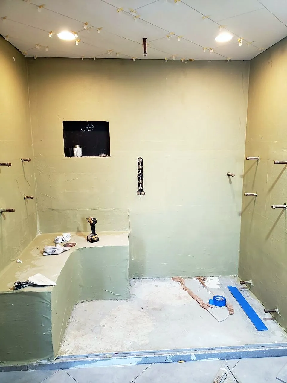 Shower bench and niche with tile spacers still in place