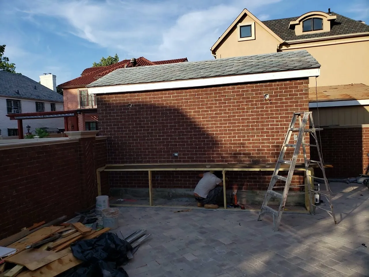 Brick garage walls built with roof framing about to start