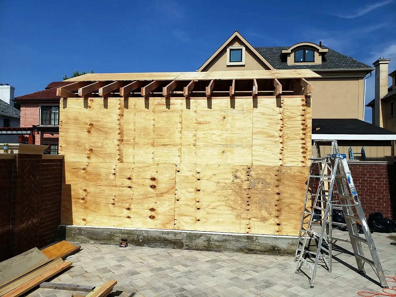 Garage roof sheathed with plywood before roofing