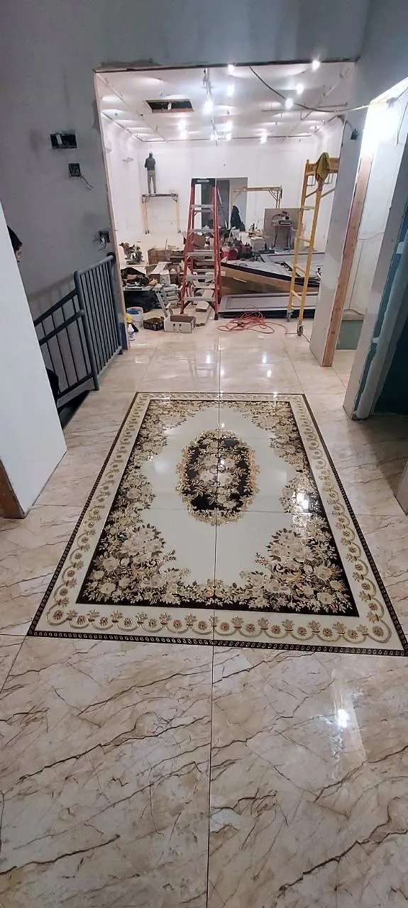 Entry hall with a marble floor medallion inlaid inside a border