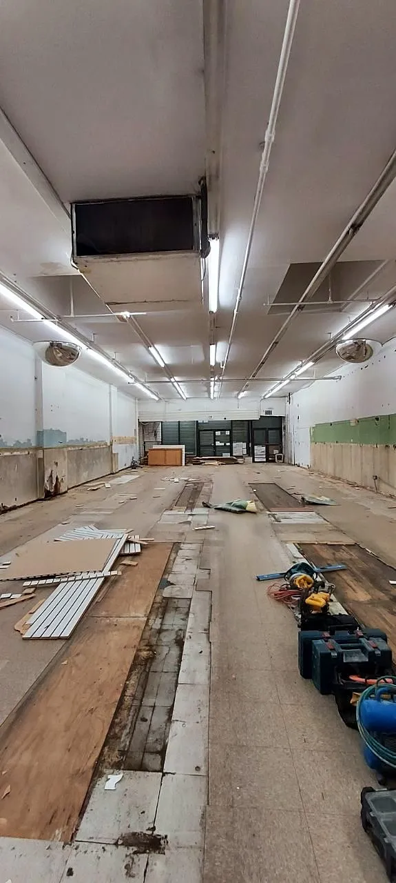 Commercial space with materials staged and framing starting