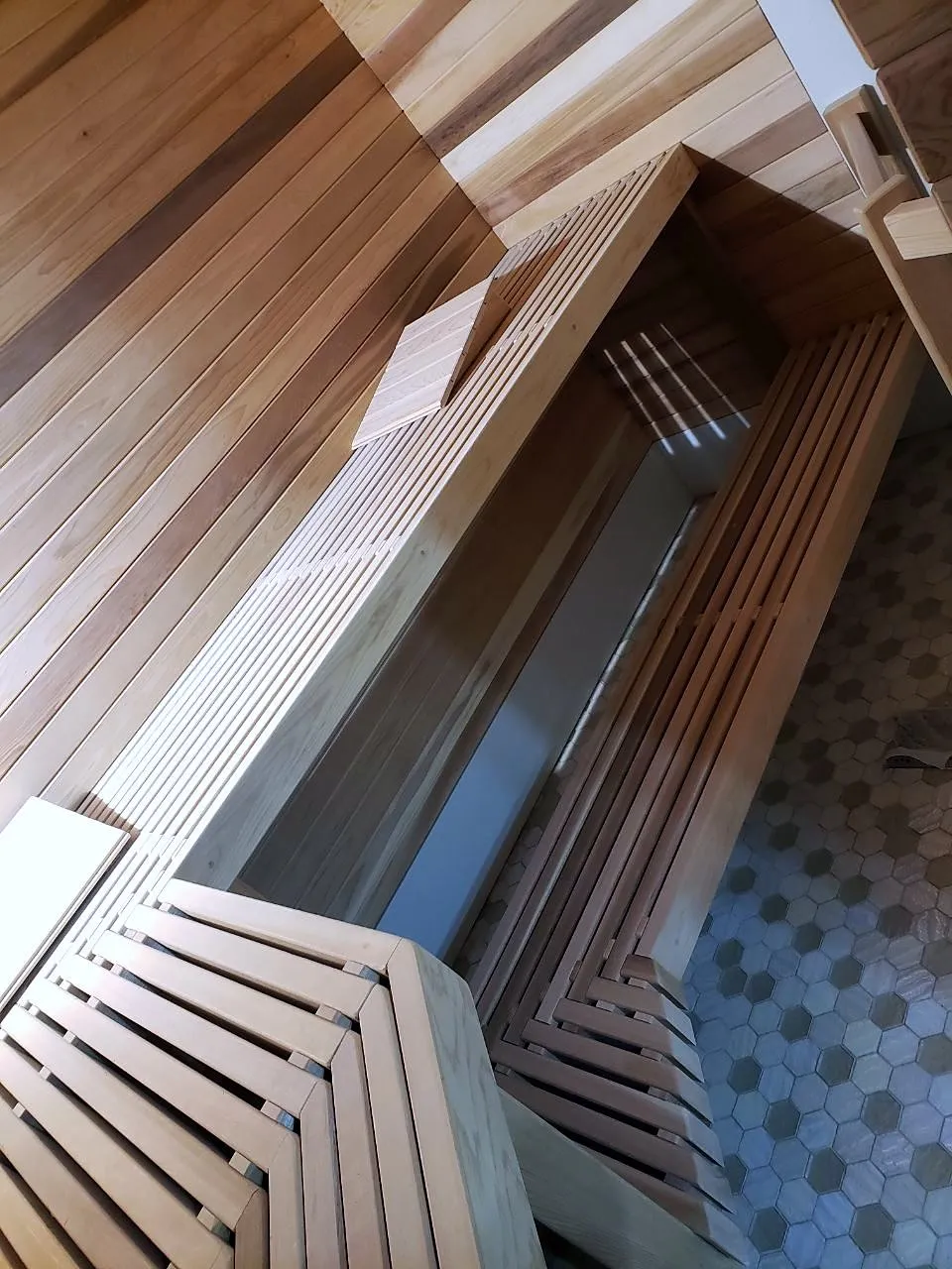 Close view of slatted cedar benches from above